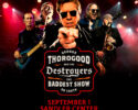 Concert poster featuring George Thorogood and the Destroyers performing on stage with a bold logo in the center and red lighting behind them.