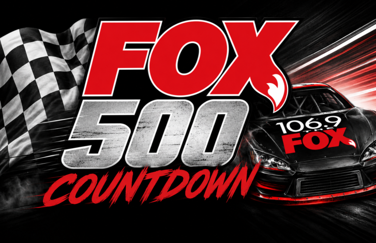 Fox 500 Countdown promotional banner featuring a red-and-black race car and a checkered flag motif on a dark background.