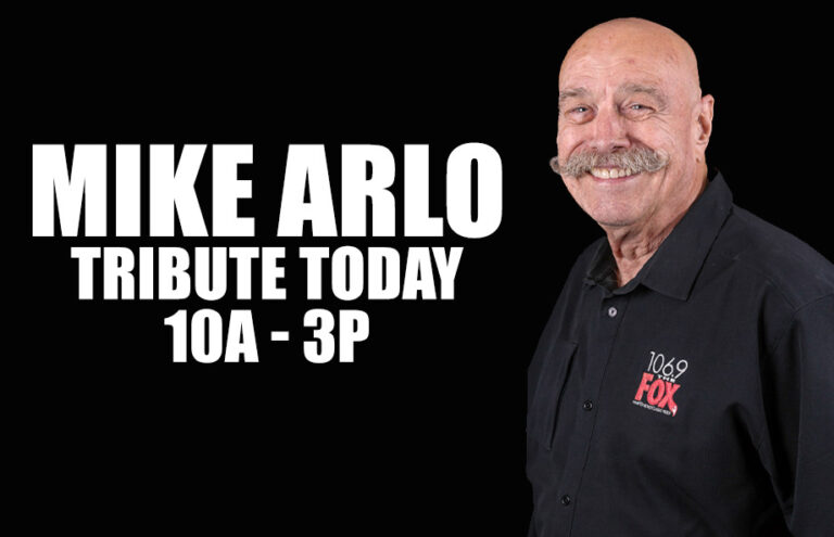 Promotional banner announcing a Mike Arlo tribute today, 10 a.m. to 3 p.m., with a smiling man in a black FOX shirt on the right.